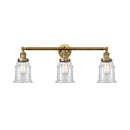 Canton Bath Vanity Light shown in the Brushed Brass finish with a Clear shade