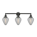Geneseo Bath Vanity Light shown in the Matte Black finish with a Clear Crackled shade