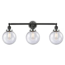 Beacon Bath Vanity Light shown in the Matte Black finish with a Seedy shade