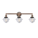 Oxford Bath Vanity Light shown in the Antique Copper finish with a Clear shade