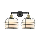Bell Cage Bath Vanity Light shown in the Black Antique Brass finish with a Matte White shade