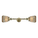 Chatham Bath Vanity Light shown in the Antique Brass finish with a Mercury shade