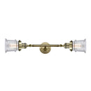 Canton Bath Vanity Light shown in the Antique Brass finish with a Seedy shade