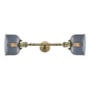 Bell Bath Vanity Light shown in the Antique Brass finish with a Plated Smoke shade