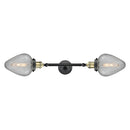Geneseo Bath Vanity Light shown in the Black Antique Brass finish with a Clear Crackled shade