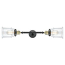 Canton Bath Vanity Light shown in the Black Antique Brass finish with a Clear shade