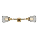 Chatham Bath Vanity Light shown in the Brushed Brass finish with a Clear shade