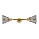 Cone Bath Vanity Light shown in the Brushed Brass finish with a Plated Smoke shade