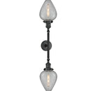 Geneseo Bath Vanity Light shown in the Matte Black finish with a Clear Crackled shade