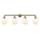 Beacon Bath Vanity Light shown in the Antique Brass finish with a Matte White shade