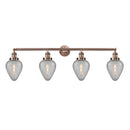Geneseo Bath Vanity Light shown in the Antique Copper finish with a Clear Crackled shade