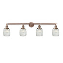 Colton Bath Vanity Light shown in the Antique Copper finish with a Clear Halophane shade