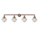 Oxford Bath Vanity Light shown in the Antique Copper finish with a Clear shade