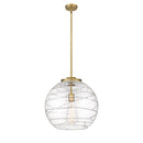 Deco Swirl Pendant shown in the Brushed Brass finish with a Clear shade