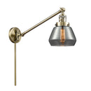 Fulton Swing Arm shown in the Antique Brass finish with a Plated Smoke shade