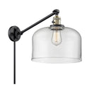 Bell Swing Arm shown in the Black Antique Brass finish with a Clear shade