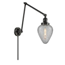 Geneseo Swing Arm shown in the Matte Black finish with a Clear Crackled shade