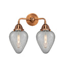 Geneseo Bath Vanity Light shown in the Antique Copper finish with a Clear Crackled shade