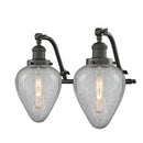 Geneseo Bath Vanity Light shown in the Oil Rubbed Bronze finish with a Clear Crackled shade