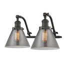 Cone Bath Vanity Light shown in the Oil Rubbed Bronze finish with a Plated Smoke shade