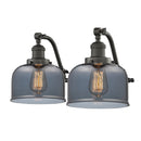 Bell Bath Vanity Light shown in the Oil Rubbed Bronze finish with a Plated Smoke shade