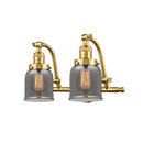 Bell Bath Vanity Light shown in the Satin Gold finish with a Plated Smoke shade
