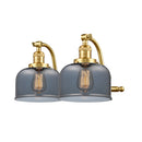 Bell Bath Vanity Light shown in the Satin Gold finish with a Plated Smoke shade