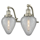 Geneseo Bath Vanity Light shown in the Brushed Satin Nickel finish with a Clear Crackled shade