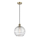 Deco Swirl Mini Pendant shown in the Antique Brass finish with a Clear shade