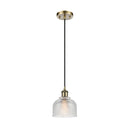 Dayton Mini Pendant shown in the Antique Brass finish with a Clear shade