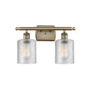 Cobbleskill Bath Vanity Light shown in the Antique Brass finish with a Clear shade