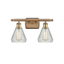 Conesus Bath Vanity Light shown in the Brushed Brass finish with a Clear Crackle shade