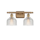 Dayton Bath Vanity Light shown in the Brushed Brass finish with a Clear shade