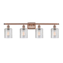 Cobbleskill Bath Vanity Light shown in the Antique Copper finish with a Clear shade