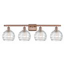 Deco Swirl Bath Vanity Light shown in the Antique Copper finish with a Clear shade