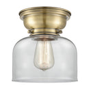 Bell Flush Mount shown in the Antique Brass finish with a Clear shade