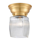 Colton Flush Mount shown in the Satin Gold finish with a Clear Halophane shade