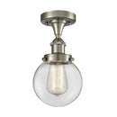 Beacon Flush Mount shown in the Brushed Satin Nickel finish with a Clear shade