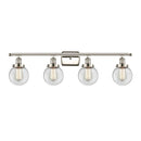 Beacon Bath Vanity Light shown in the Polished Nickel finish with a Clear shade