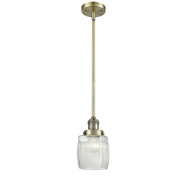 Colton Mini Pendant shown in the Antique Brass finish with a Clear Halophane shade