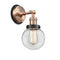 Beacon Sconce shown in the Antique Copper finish with a Clear shade