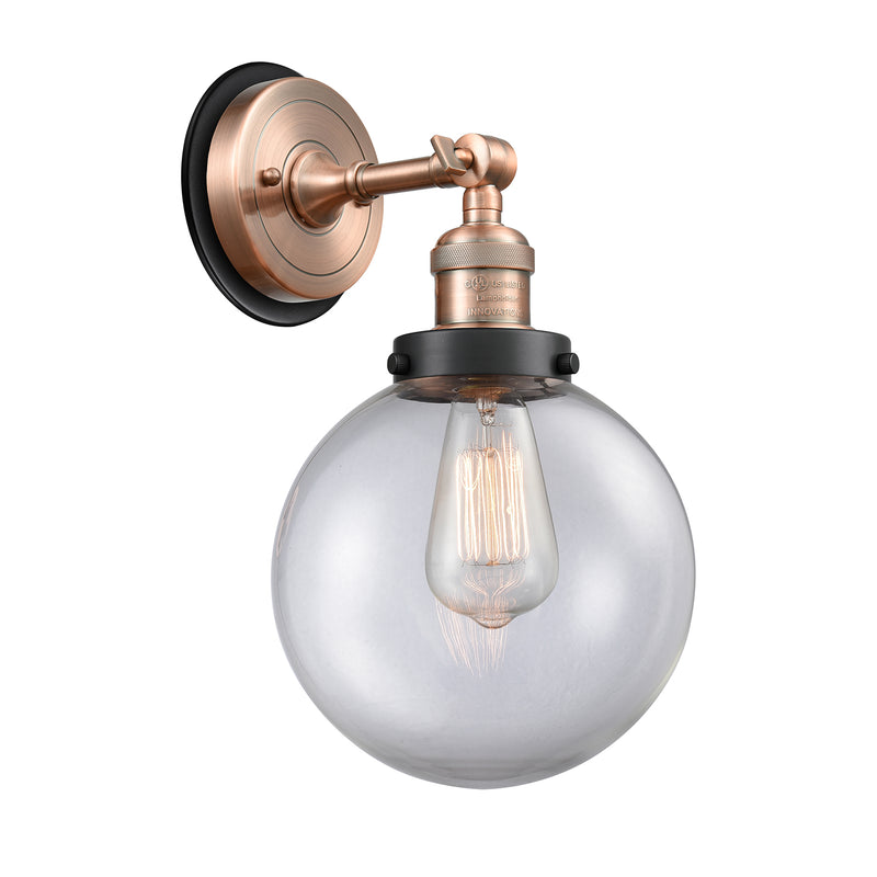 Beacon Sconce shown in the Antique Copper finish with a Clear shade