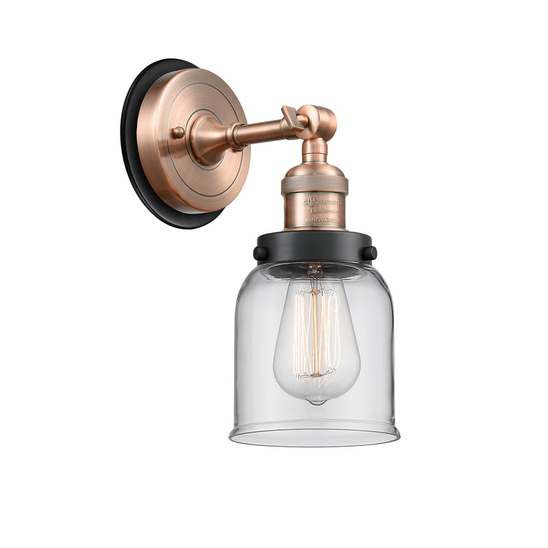 Bell Sconce shown in the Antique Copper finish with a Clear shade