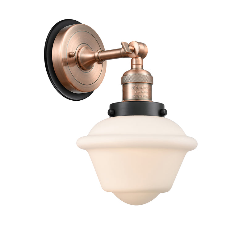 Oxford Sconce shown in the Antique Copper finish with a Matte White shade