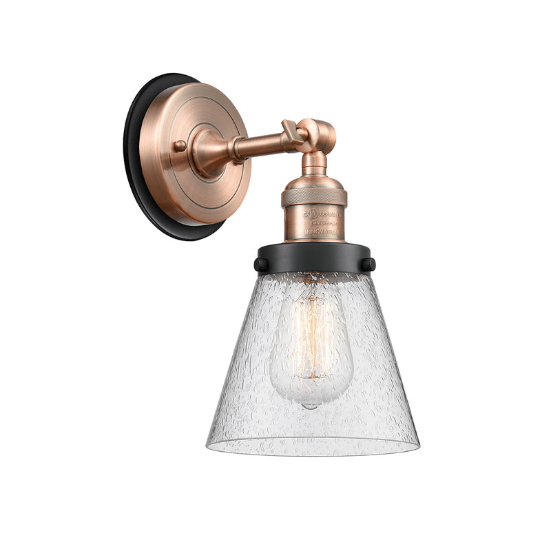 Cone Sconce shown in the Antique Copper finish with a Seedy shade