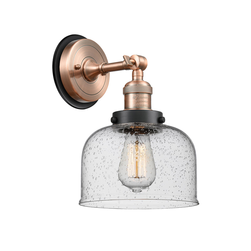 Bell Sconce shown in the Antique Copper finish with a Seedy shade