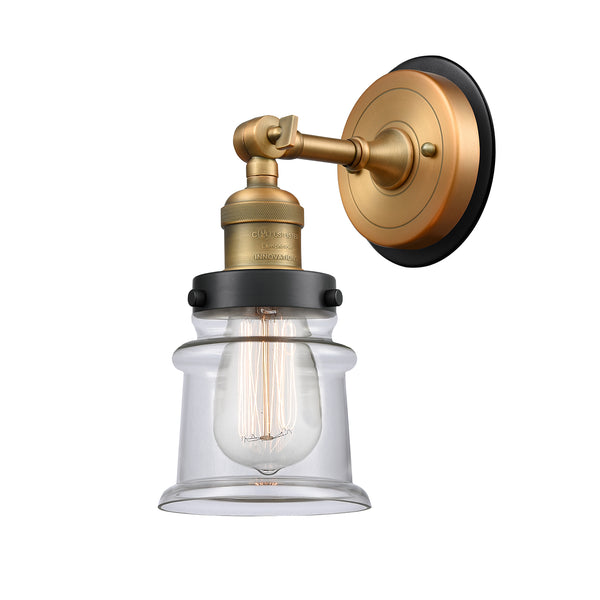 Canton Sconce shown in the Brushed Brass finish with a Clear shade