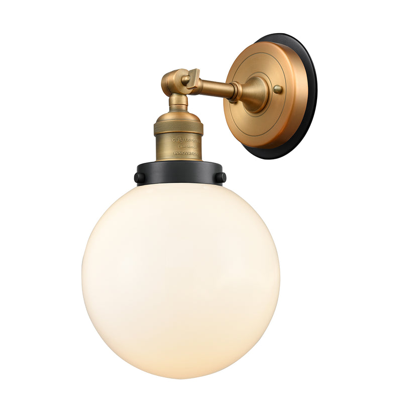 Beacon Sconce shown in the Brushed Brass finish with a Matte White shade