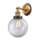 Beacon Sconce shown in the Brushed Brass finish with a Clear shade