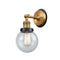 Beacon Sconce shown in the Brushed Brass finish with a Seedy shade